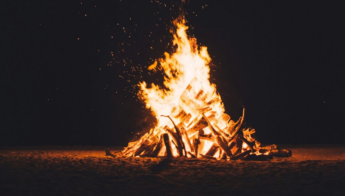How do you light a wood stove using the Swiss method?